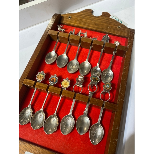 22 - Collection of decorative spoons with display case