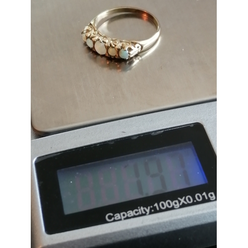 28A - 9ct gold ring set with 5 opals 1.94 grams