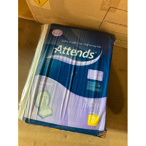 77 - Large box full of attends sanitary pads