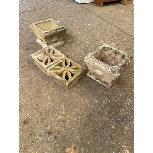 200 - Pair of concrete garden planters on bases