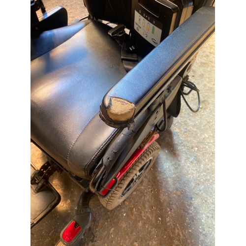 214 - Electric wheelchair - 4mph - with charger - some wear but working order