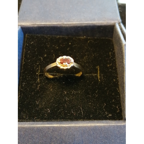 28A - 9ct gold ring set with red gemstone Size M 1.10 grams