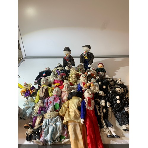 45 - Large quantity of dolls - mainly clowns with ceramic faces
