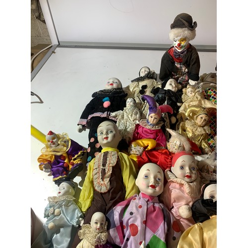 45 - Large quantity of dolls - mainly clowns with ceramic faces