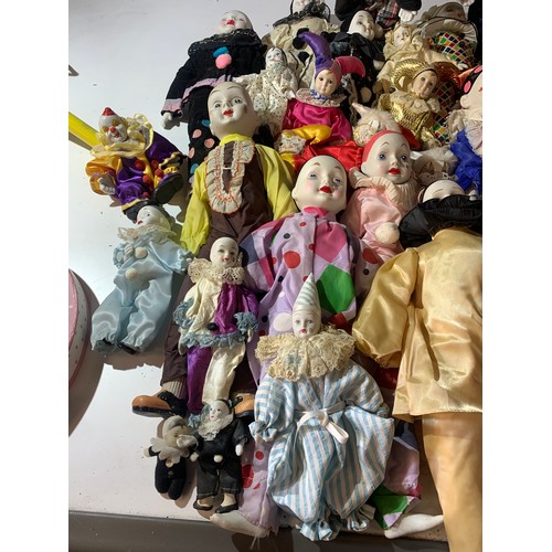 45 - Large quantity of dolls - mainly clowns with ceramic faces