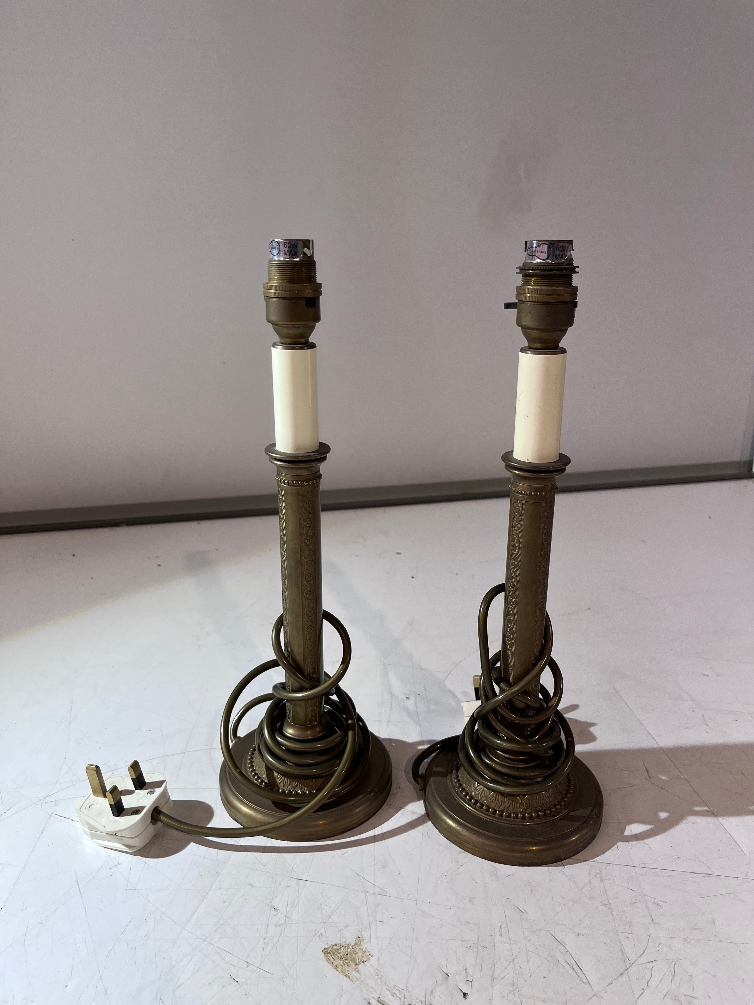a pair of brass decorative column table lamps by Valsan