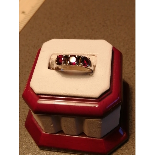 22A - Silver ring set with 3 red gemstones 3.47 grams Size Q