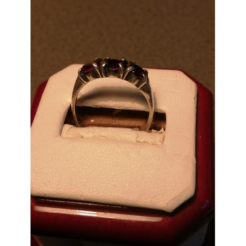 22A - Silver ring set with 3 red gemstones 3.47 grams Size Q