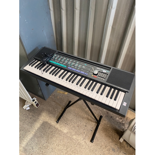 Yamaha PSR-150 keyboard with stand