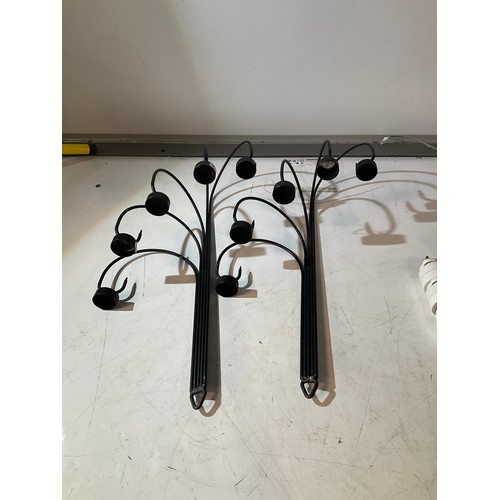 199 - 2 black metal wall sconces with 4 tea light holders on each