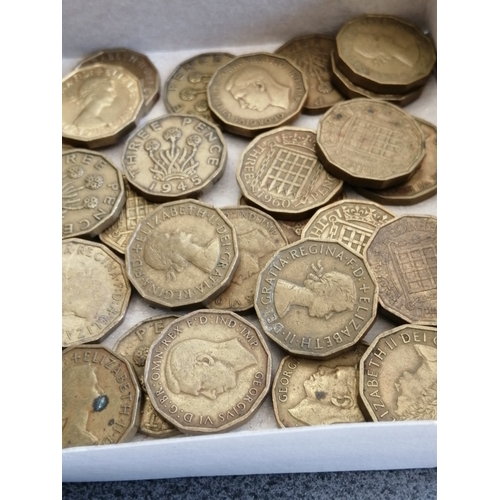 30A - Box of approximately 60 brass threepenny bits