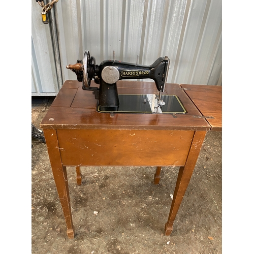 131 - Harris No22 hand crank sewing machine in the table