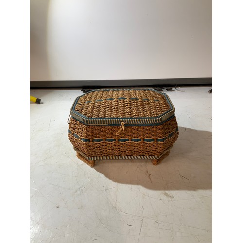 213 - plaited wicker sewing basket with four small legs and padded interior lid