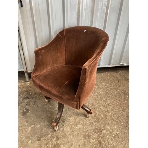 84 - Velour brown swivel chair on castors