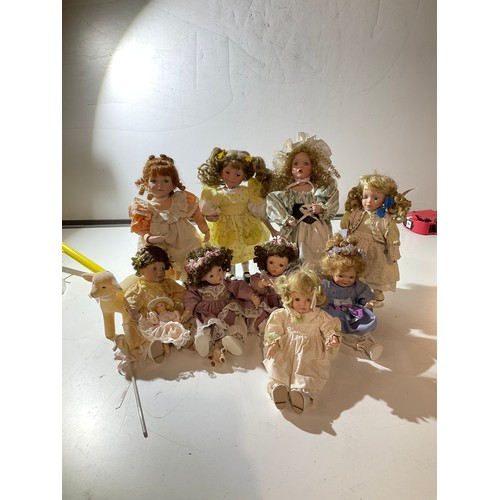 136 - Collection of Dolls  with porcelain hand feet and faces