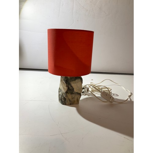 204 - heavy stone based table lamp with red shade