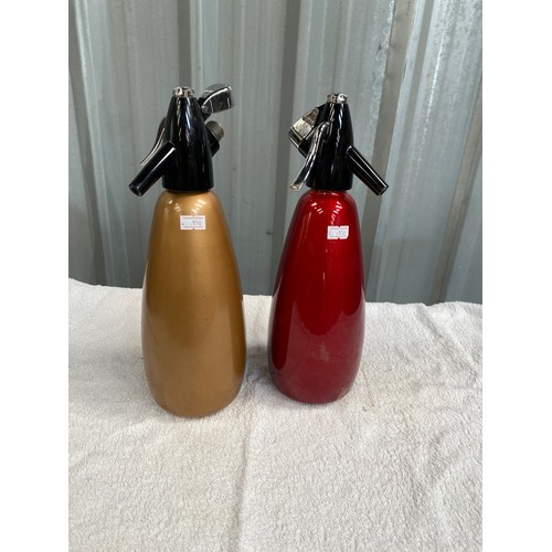 160 - two vintage BOC  soda syphons gold coloured serial No. SHUX and red Serial No. SHUV
