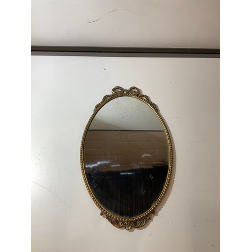 172 - Brass decorative narrow oval framed mirror