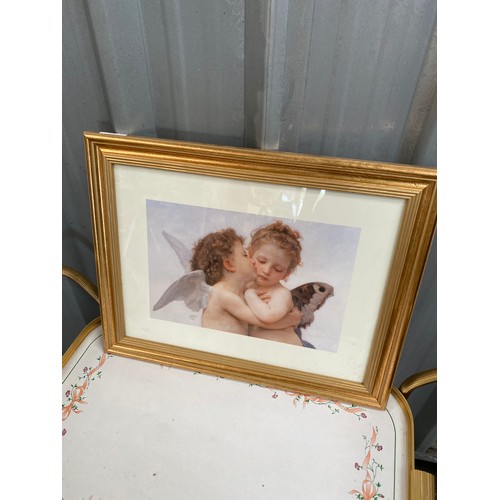 89 - gold coloured framed print of two cherubs embracing