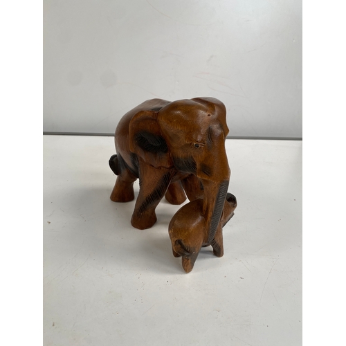 73 - Adult and baby wooden elephant figure