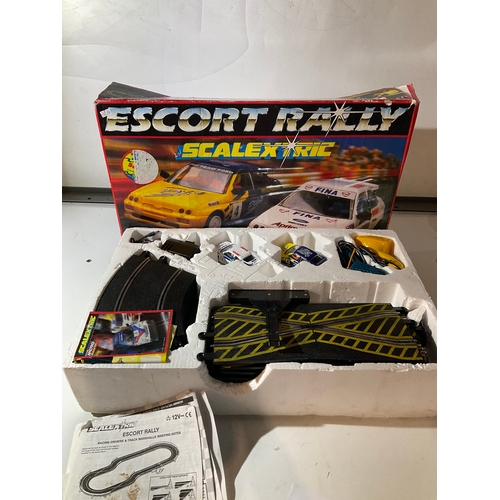 303 - Escort rally scalextric with cars