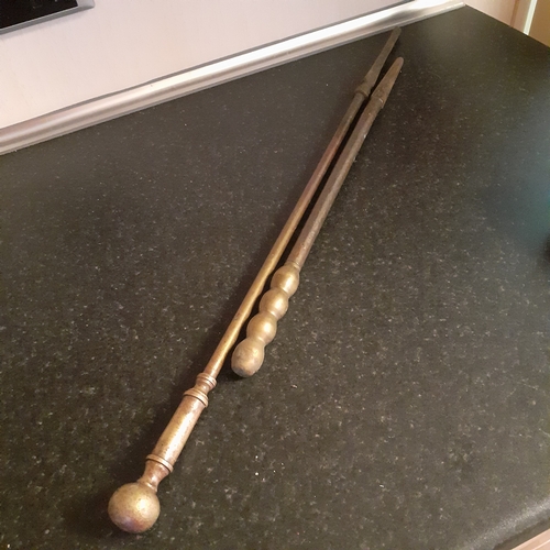 4 - 2 x heavy solid brass pokers. Longest over 2 ft. Combined weight approx 1.2kg