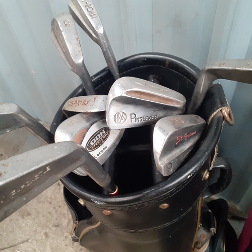 24 - Golf bags and irons including pinseeker, parcastle, St Andrews and other