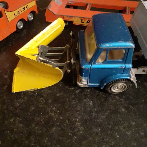 12 - 2 x diecast trucks, dinky and matchbox. One snowplough and a truck and trailer car transporter.