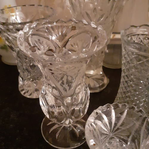 29 - Quantity of glass vases. 16 in total. Including crystal and coloured glass.
