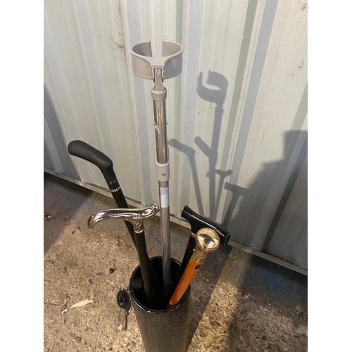 271 - Large umbrella/stick stand pot with various crutches and walking sticks