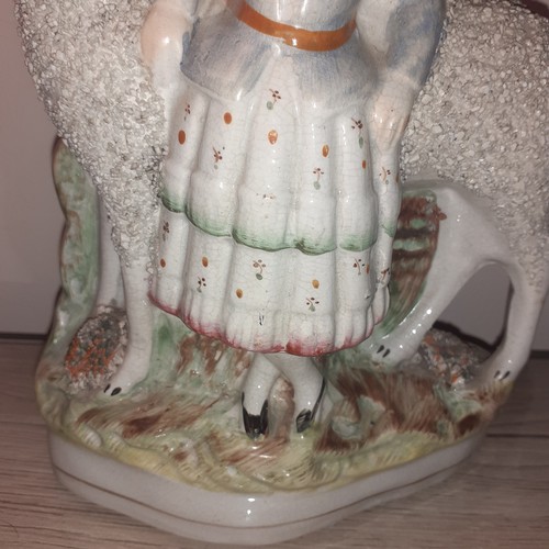 25 - Early Staffordshire circa 1930s girl and sheep figurine