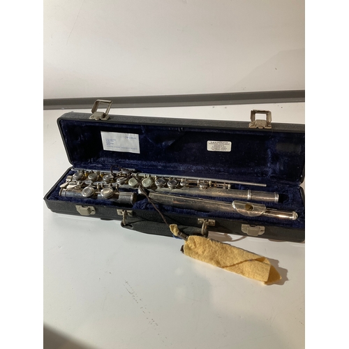 34 - Petrus metal flute in case