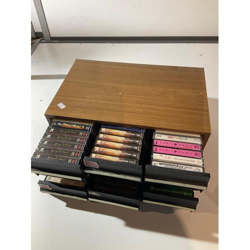 140 - Quantity of cassette tapes in case with drawers