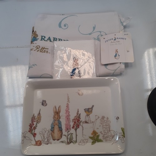 12 - Assorted Beatrix Potter items including a tray, flannel and tea towel