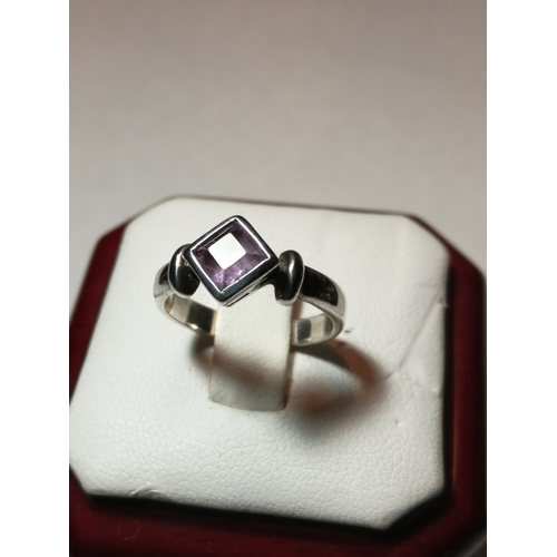 24A - Silver ring set with diamond shaped purple gemstone 3.0 grams Size M