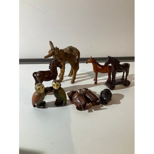 98 - Selection of treen ornaments horses, buddha etc plus two owls (Not Treen)