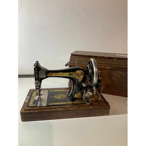 106 - Vintage hand singer sewing machine in wooden carry case