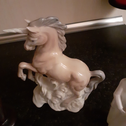 4 - A quantity of 5 figurines including soapstone, unicorn, etc