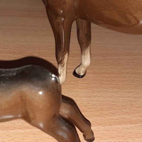 12 - Beswick horse and 2 Beswick ponies. One pony has damage.