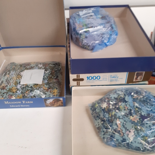 19 - A quantity of jigsaw puzzles. All pieces bagged inside, should be complete