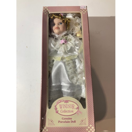 73 - Windsor collection genuine hand painted porcelain doll with white silk and lace dress