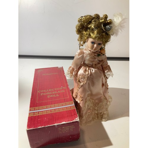 82 - Alberon Collectors porcelain Doll with a silk peach coloured dress