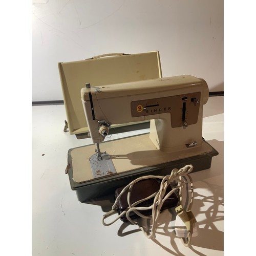 121 - singer sewing machine with control foot