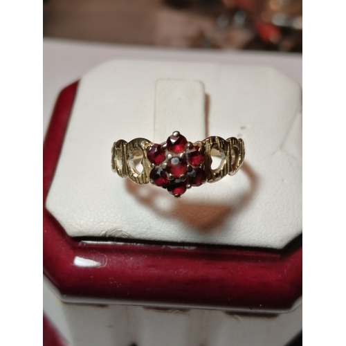 28A - 9ct gold ring set with 7 garnets 1.82 grams Size J