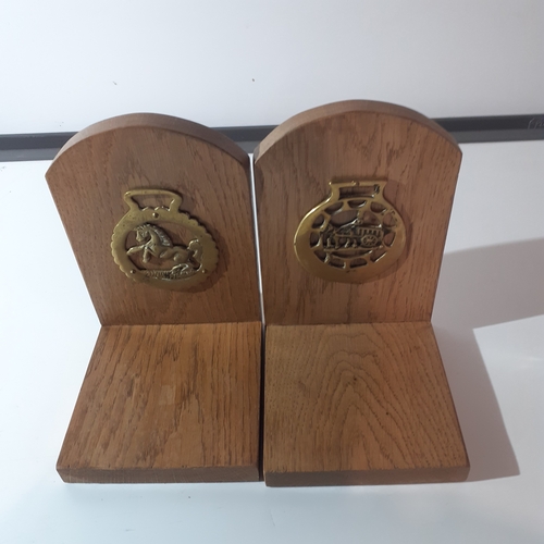 3 - Pair solid wood oak bookends with a horse brass attached