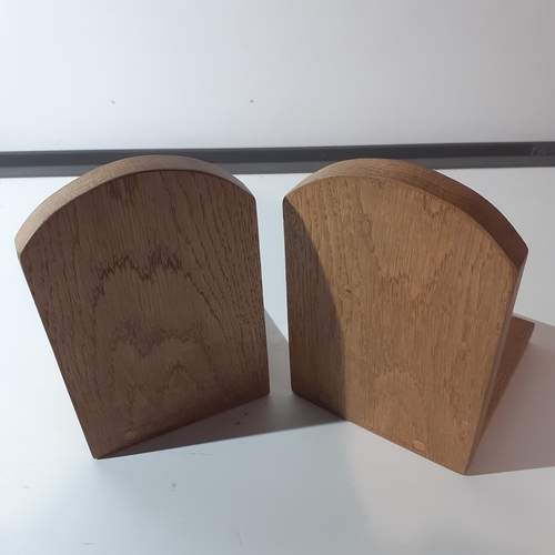 3 - Pair solid wood oak bookends with a horse brass attached