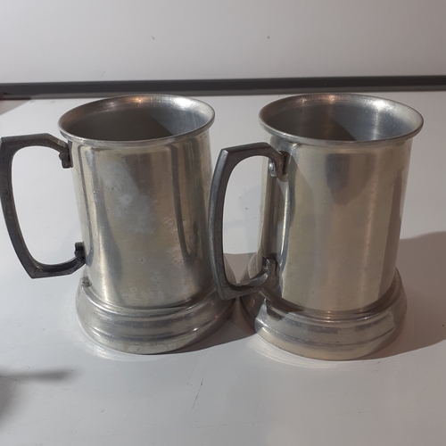 4 - Pair of cigarette advertising metal  tankards. Rothmans cigarettes, advertised on the clear base of ... 