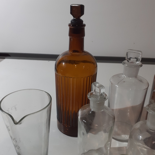 10 - Quantity of interesting medical/measuring bottles, mostly vintage.