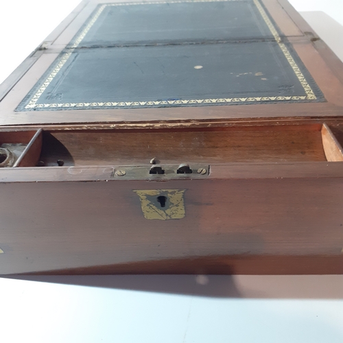 26 - Antique wooden writing slope with inkwell and internal compartments. Brass decorated corners. No key... 