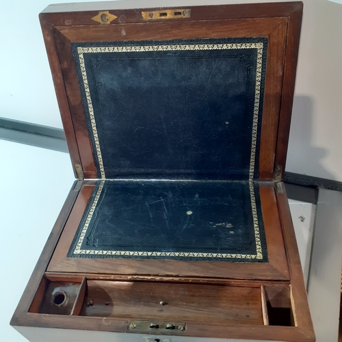 26 - Antique wooden writing slope with inkwell and internal compartments. Brass decorated corners. No key... 